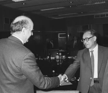 Handshake between Zhao Ziyang, on the right, and Etienne Davignon