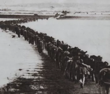 Chinese troops cross the Yalu River, 1950, to fight in the Korean War.